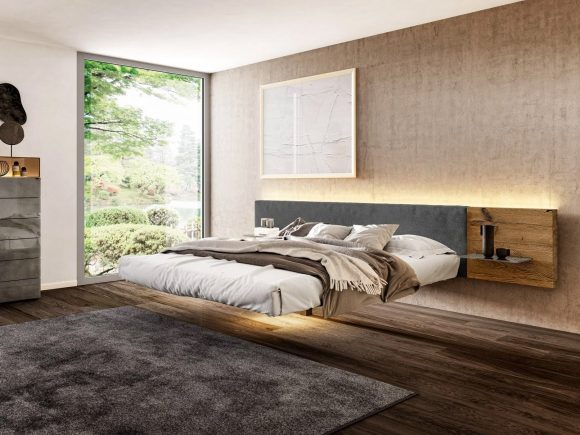 Floating bed design, with integrated headboard and lighting, above a dark wood floor and a grey rug.