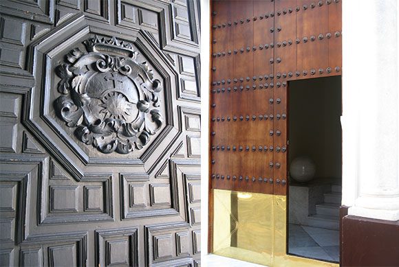 Left image is a classical geometric carved door with a family crest in the center, right image is a modern door with metal panina and large black metal grommets on multiple panels, and a shiny brass panel at the bottom with the doorway itself at the bottom right.