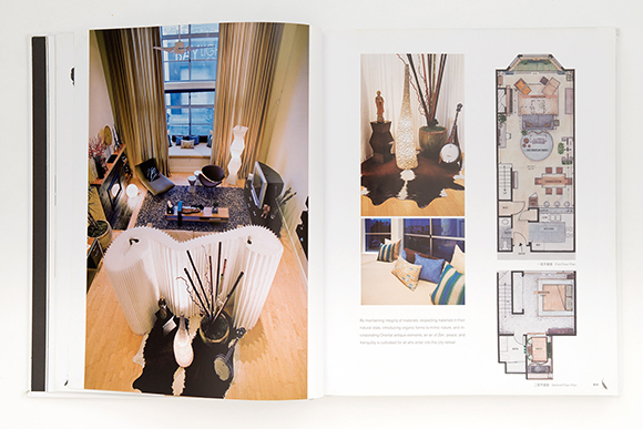 Photo of an open book showing 2-page spread with colorful photos of an apartment viewed from above, and a floor plan.