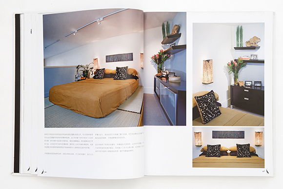 Photo of an open book showing 2-page spread with colorful photos of a peaceful bedroom and simple sideboard storage.