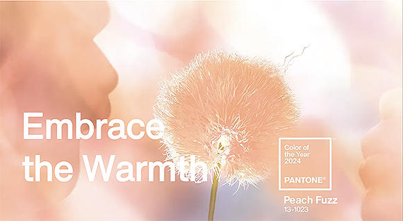 Drawn in peach color: A person blowing on a dandelion, with white text saying Embrace the Warmth, and in a small square, Color of the Year 2024 Pantone and underneath Peach Fuzz 13-1023.